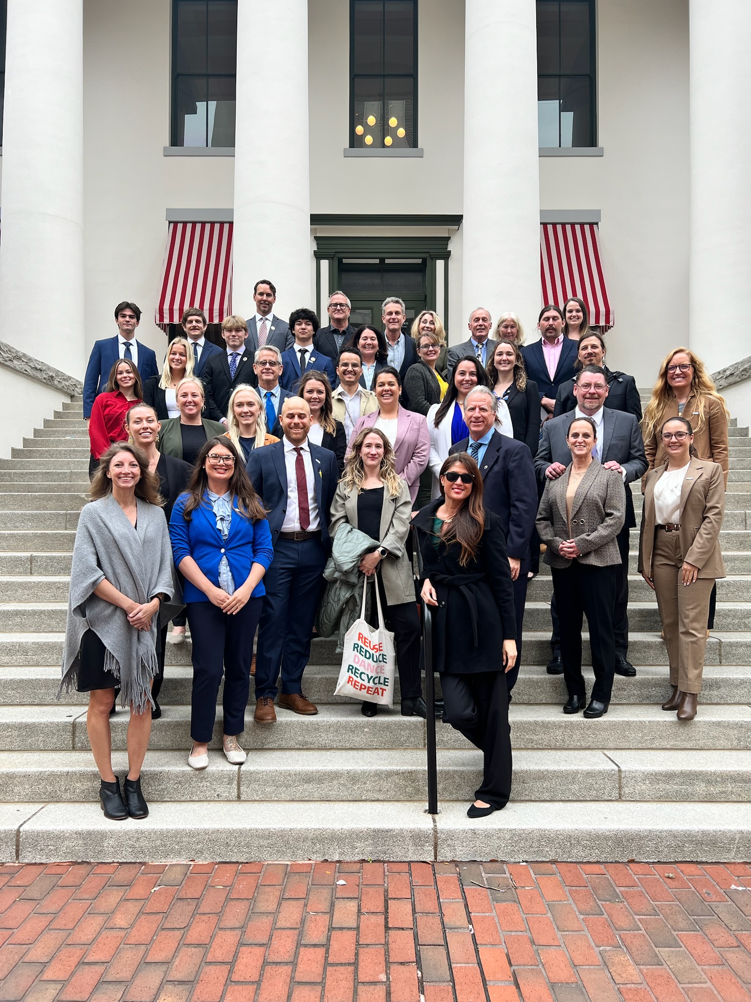 40 Surfrider volunteers standing on the steps of the Florida State Capitol