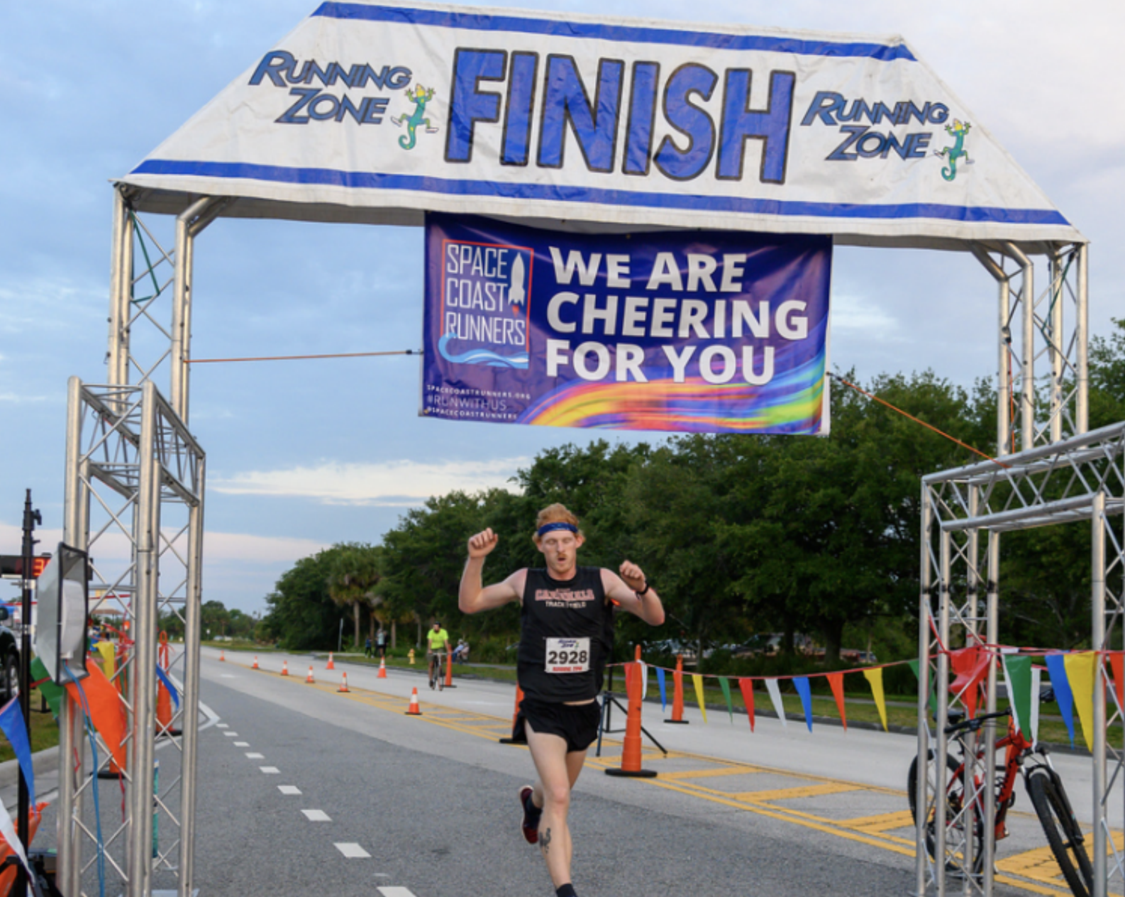 Runner running across finish line